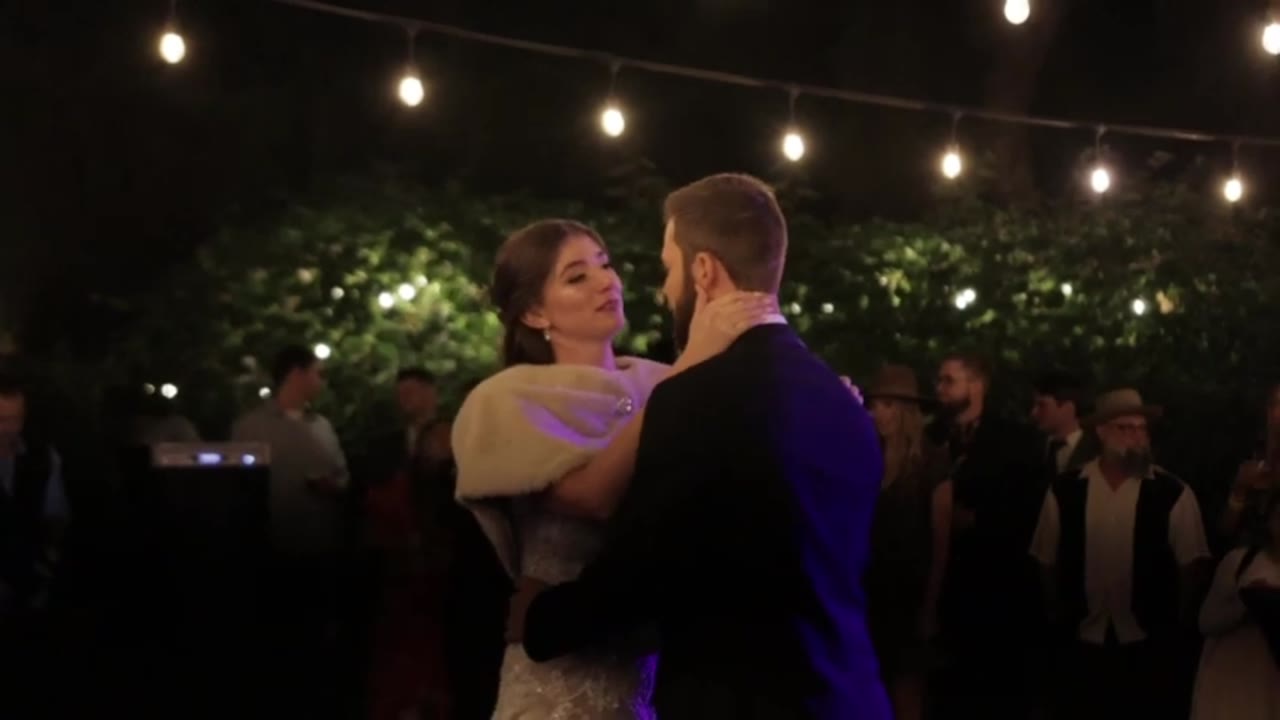 Wedding film clip: the first dance beneath string lights